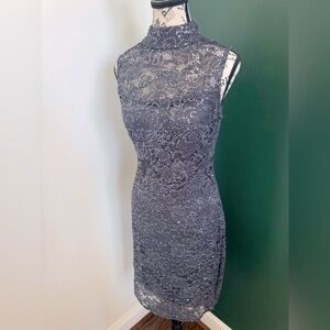 Dark gray sleeveless cocktail dress. Size 8 with stretch. In great condition.